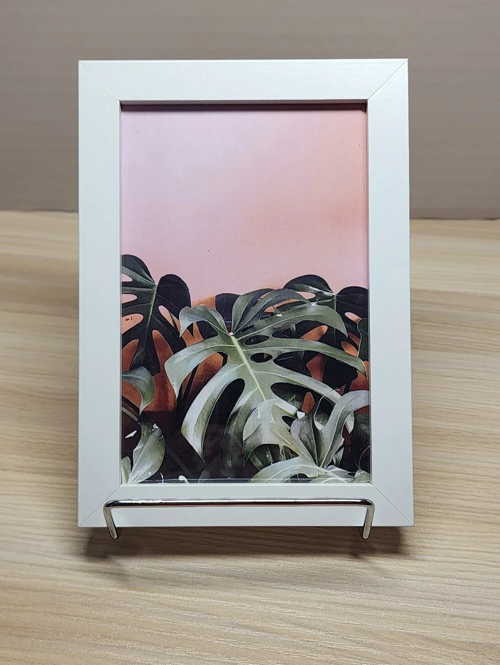 White Framed Monstera Wall Art with Pink Background